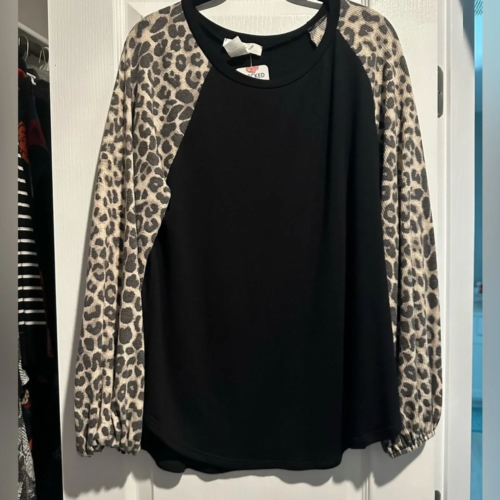 Women’s black top. - Picture 1 of 3